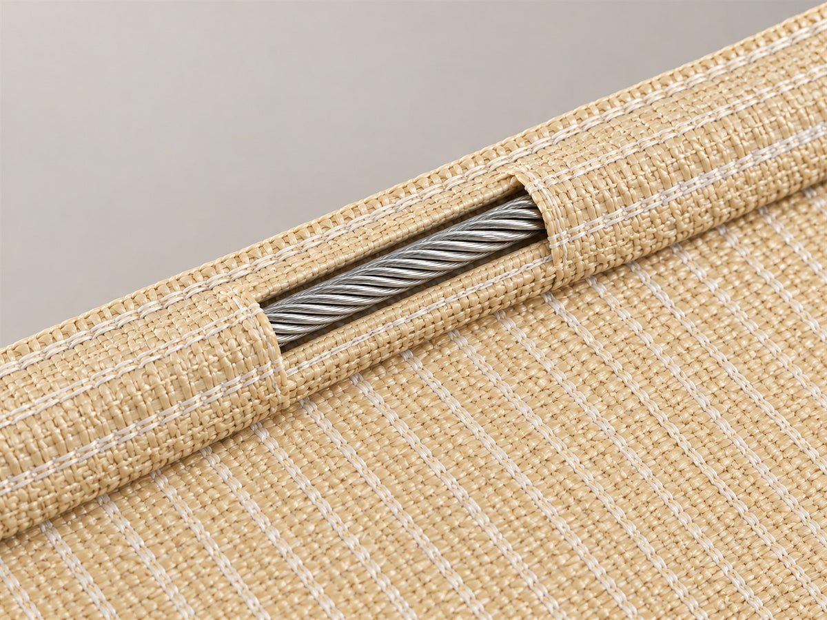 Illustrative cutaway showing the steel cable inside a beige stitched shade-sail hem.